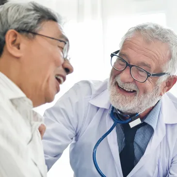 A man in white shirt and tie with a doctor.